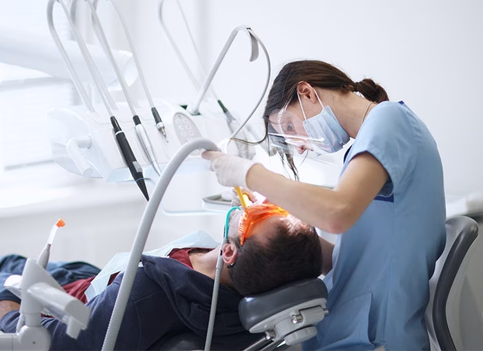 Dentist-performing-procedure-on-dental-patient