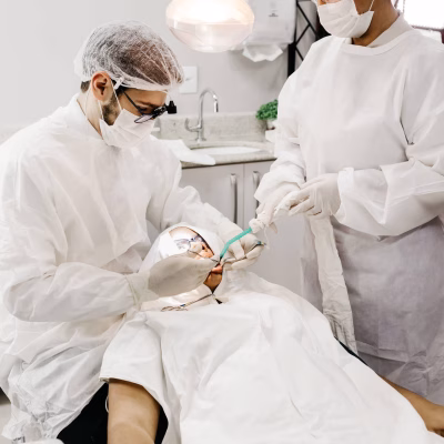 dentists-in-scrubs-with-patient-dentistry-j6t2w3qne642r4l4